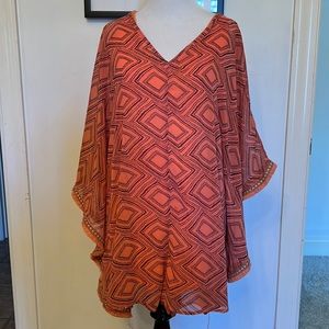 Womens romper bought at a boutique. Size Small but can fit for a small or medium